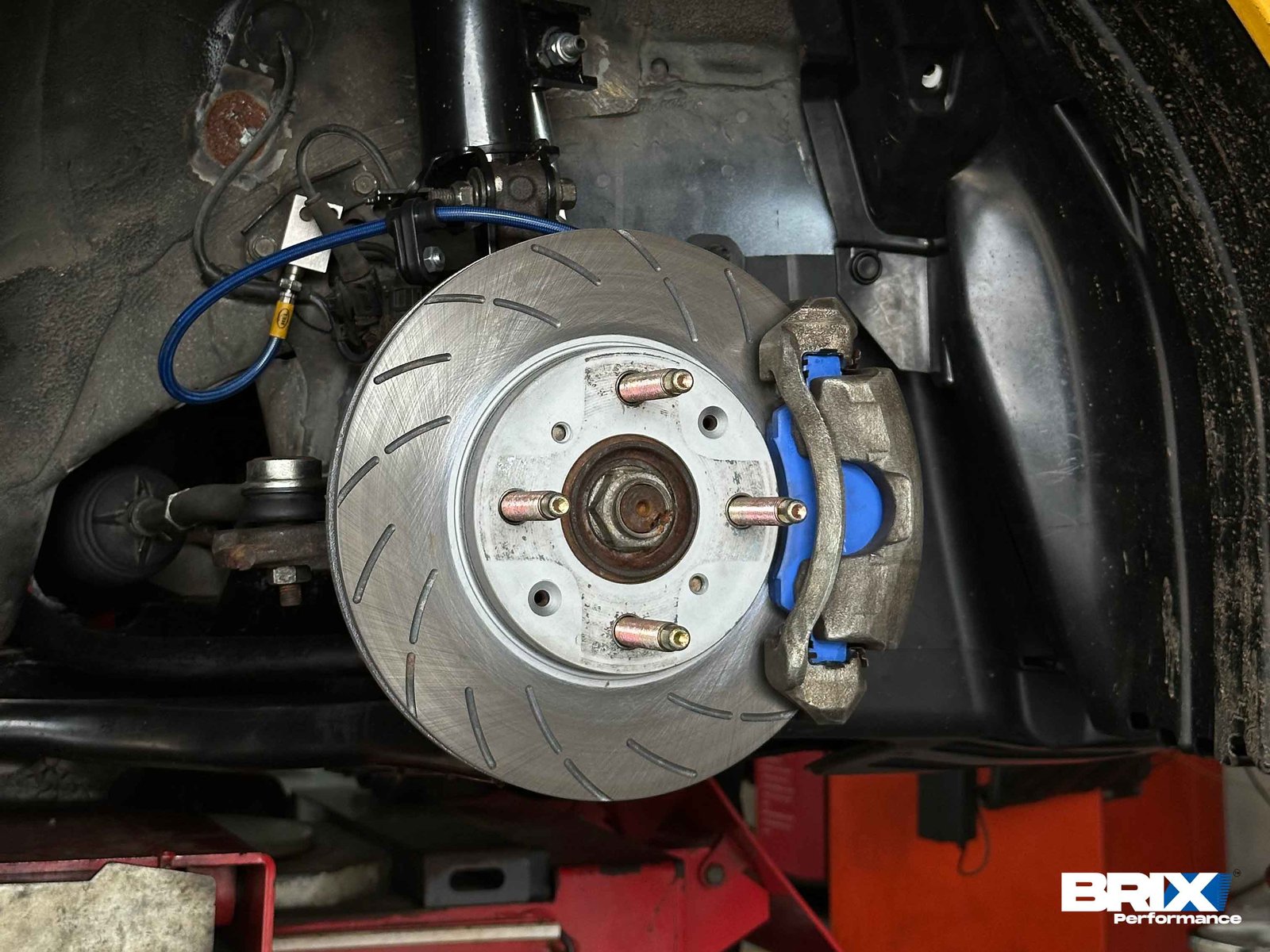 Close-up of BRIX Performance Competition Series rotor and Endless ME20 brake pads installed on Garage One’s Honda Jazz GD3.
