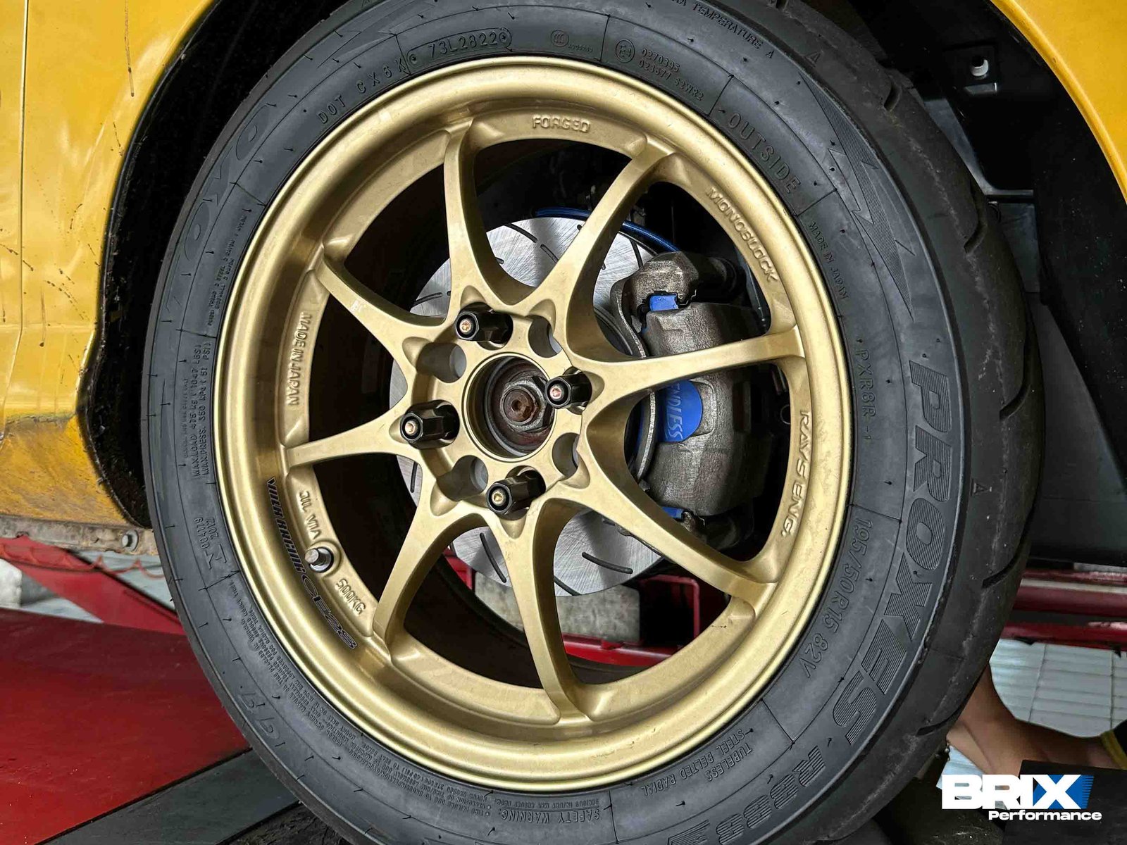 Close-up view of BRIX Performance Competition Series and Endless ME20 brake pads installed with the wheel mounted on Garage One’s Honda Jazz GD3.