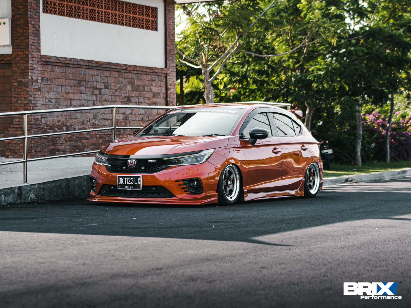 A modified Honda City Hatchback with lowered suspension and performance modifications featuring BRIX Performance Competition Series.