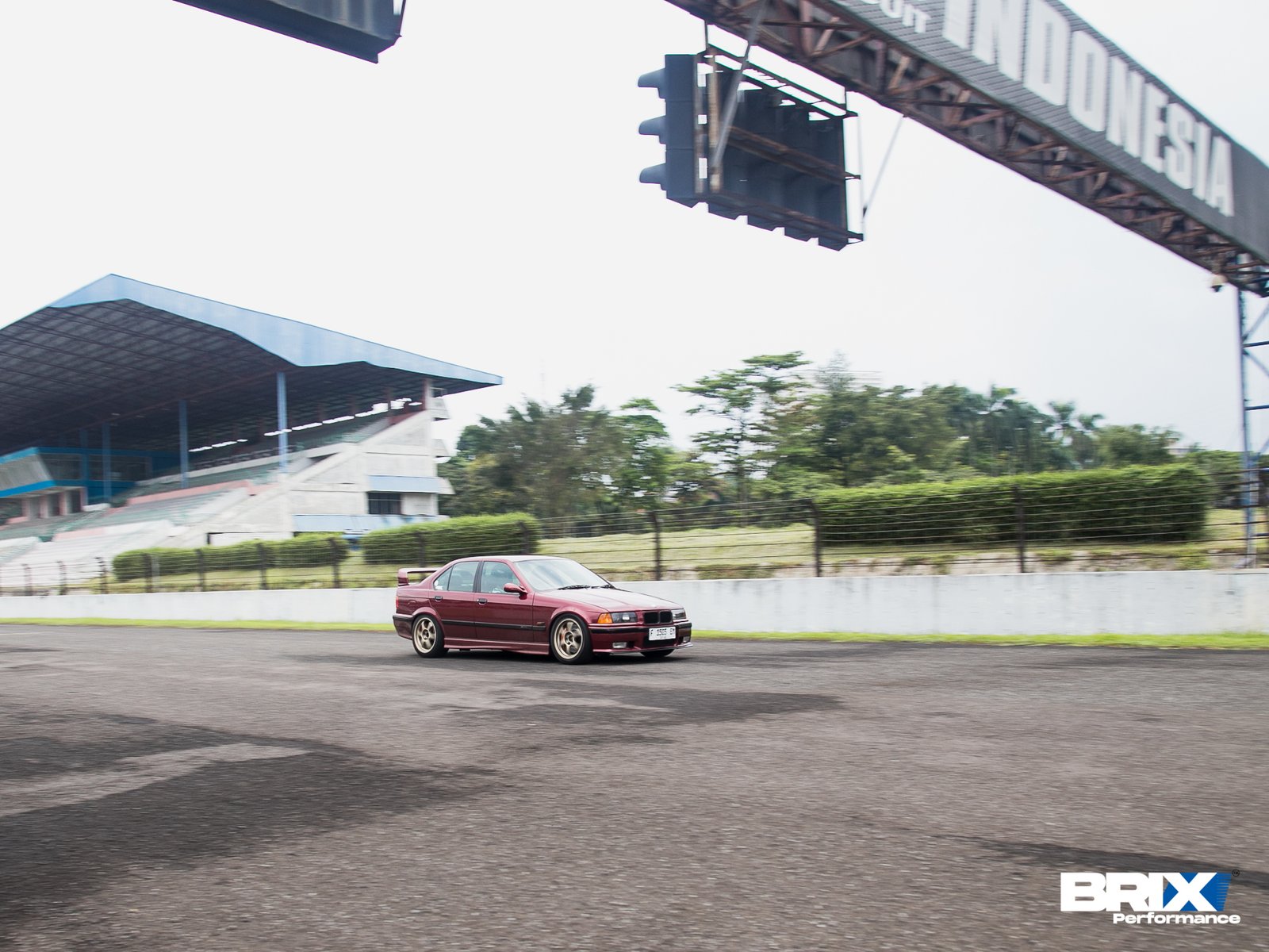 BMW E36 driving on Sentul International Circuit, captured in motion with BRIX Performance upgrade.