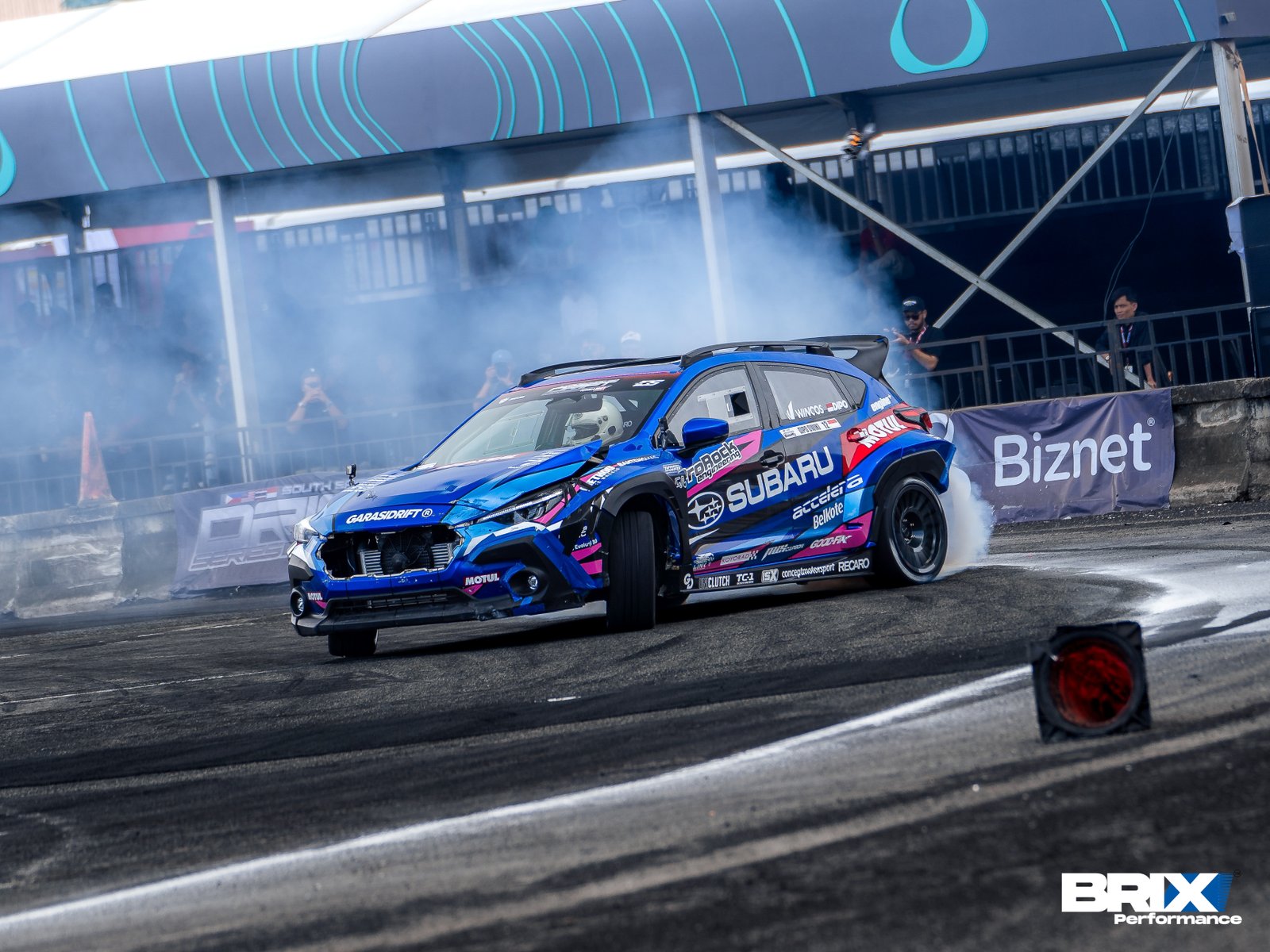 Subaru Crosstrek by Garasi Drift drifting at Southeast Asia Drift Series with tire smoke.