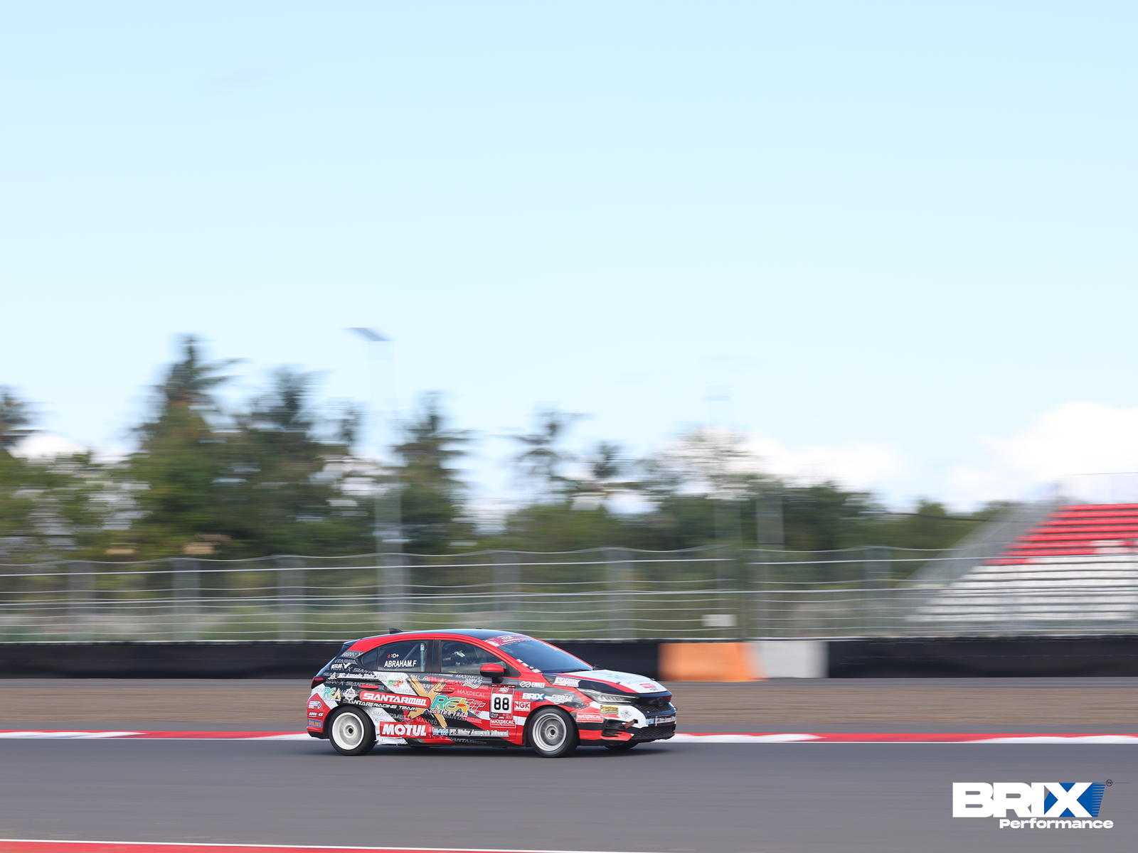 Honda City Hatchback equipped with BRIX Competition Series speeding on Mandalika International Street Circuit.